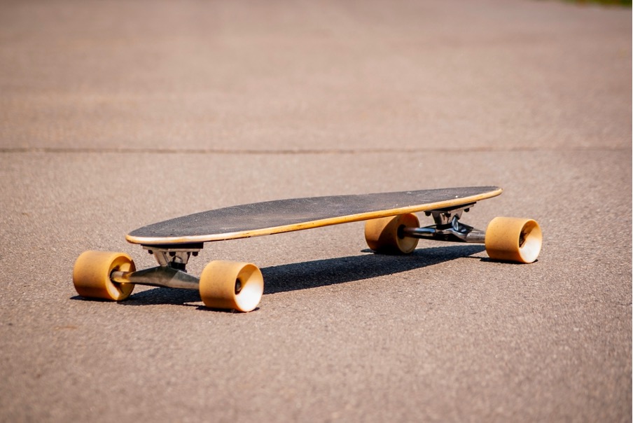 Longboard pintail sunny day summer park blurred background