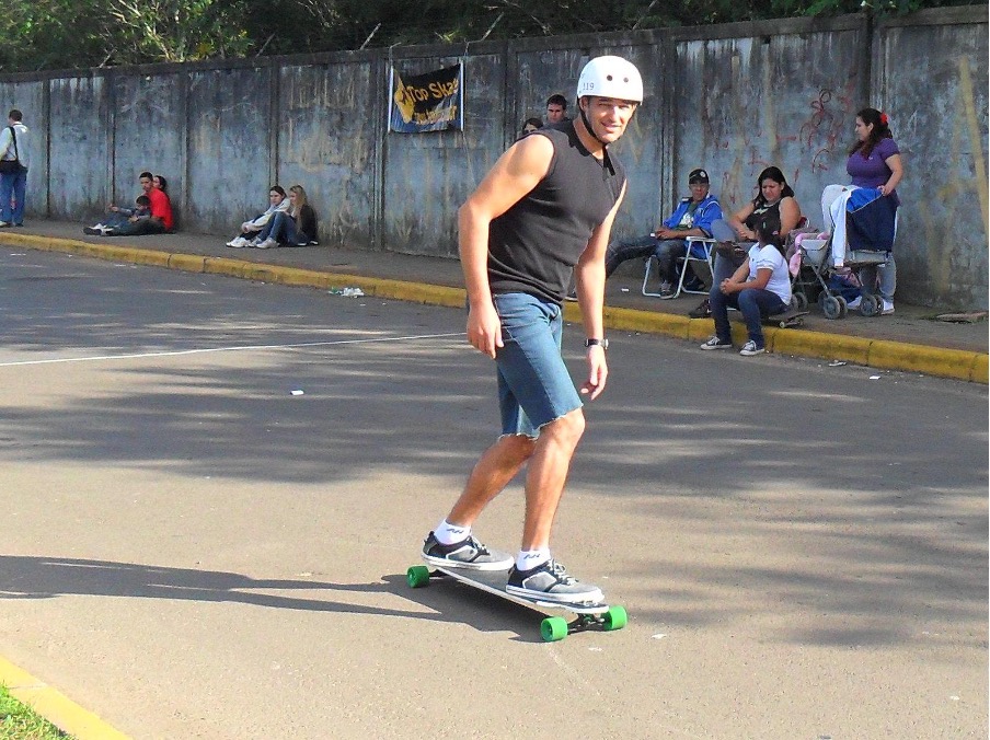 A man pump on a longboard