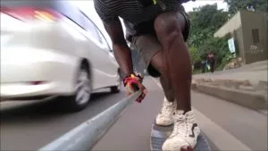 a car on a road, symbolizing the dangers of downhill skateboarding with traffic