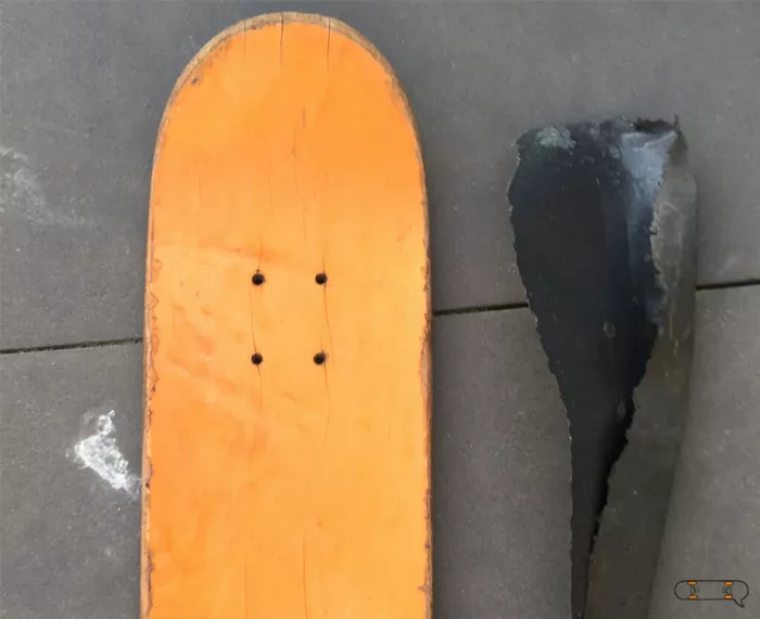 A clean longboard deck after the old grip tape has been removed