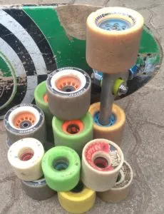 A close-up of a skateboard wheel, showing its durometer and the texture of the urethane