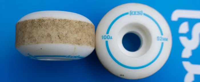 A close-up of CCS brand skateboard wheels