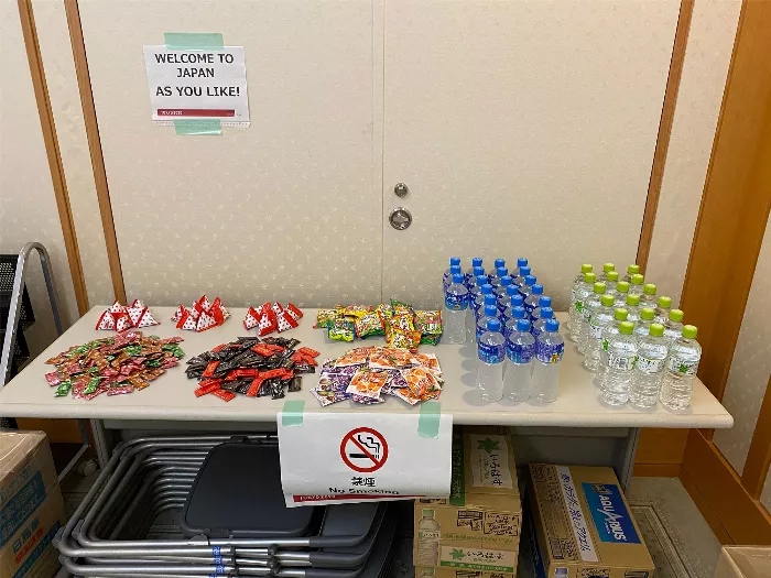 A close-up shot of various Japanese snacks, including gummies and chocolates, arranged on a surface.