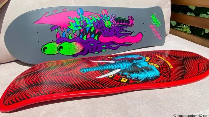 A collection of diverse old-school skateboard decks, showcasing their unique shapes and designs tailored for cruising and tricks.