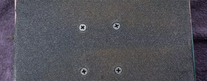 A comparison photo showing the difference between a clean and dirty section of the longboard's grip tape