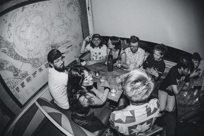 A crowd of people enjoying music at the Jenkem party during the Tribeca Music Lounge event.