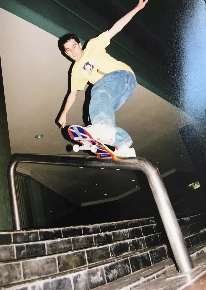 A front boardslide showcasing a different skateboarding trick from the same skater