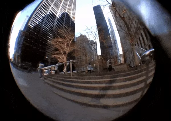 A GIF of a person doing an ollie, filmed using a laptop