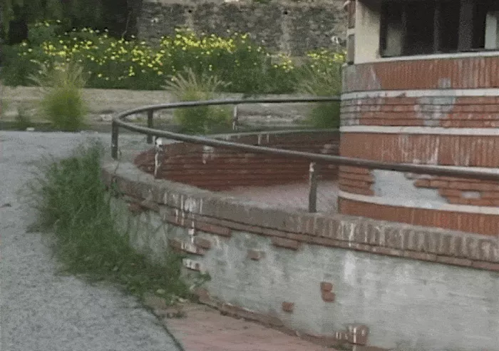 A GIF showing longboarders cruising through a Sicilian village