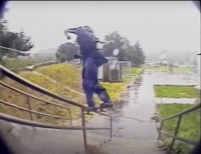 A group of people watching a skateboarding video, reflecting the community aspect of skate culture