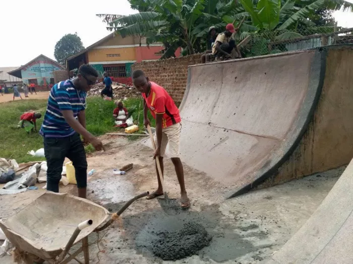 A group of skateboarders from Uganda skate at their local skatepark