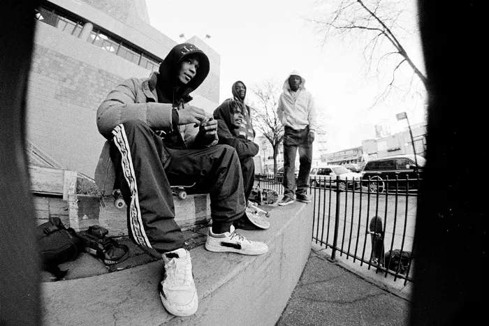 A group of skaters from Public Housing Skate Team posing together outdoors, showcasing their unique style and camaraderie.