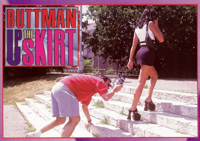 A low angle shot of Buttman filming an adult scene