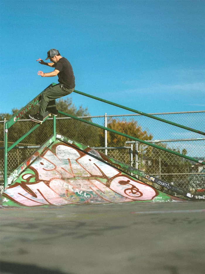 A photo of Gordon Eckler doing a 50/50 stall on a skateboard.