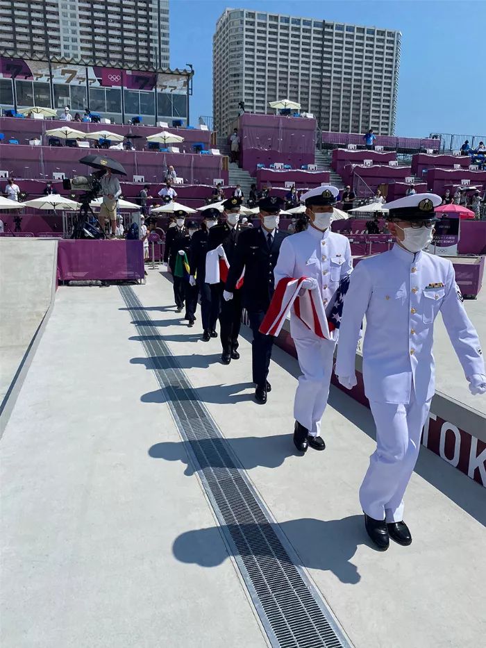 A photo of the medal ceremony at the Tokyo Olympics, capturing the atmosphere and the press presence.