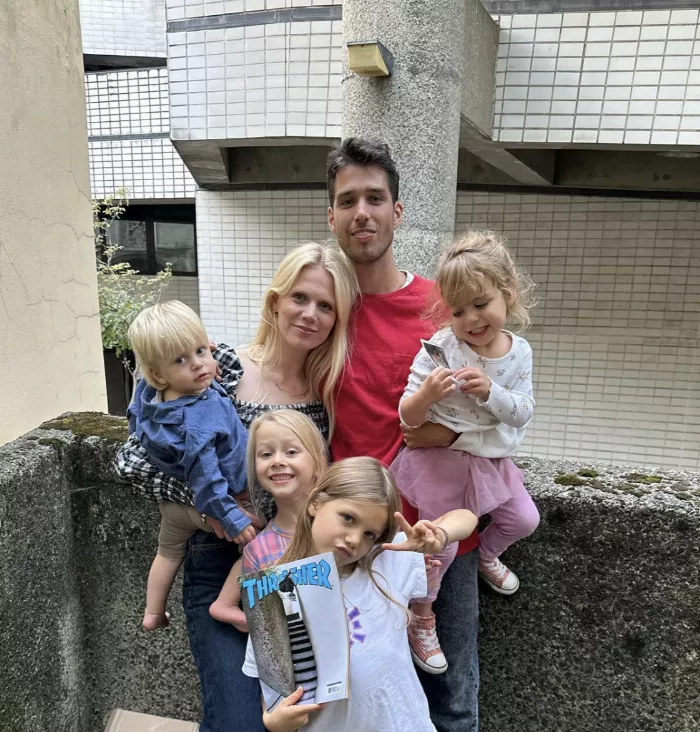 A photograph of Tom Knox, smiling, with his family.