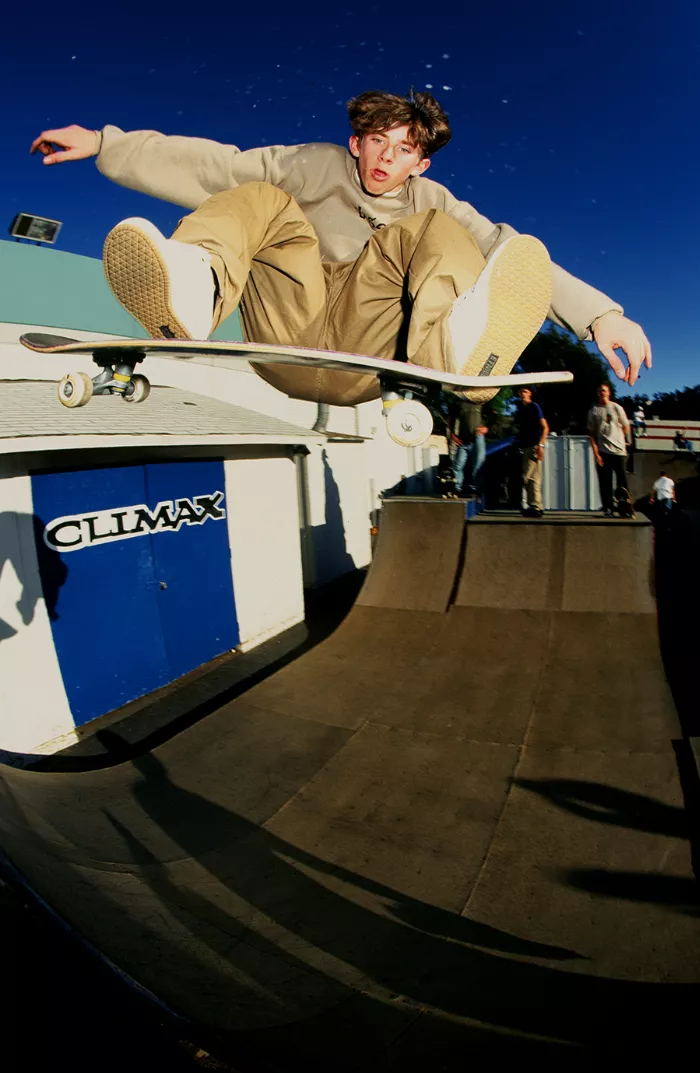 A photograph of Tom Penny in 1995, captured by Grant Brittain, demonstrating his effortless style and influence on skateboarding