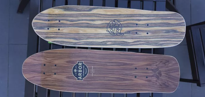 A side-by-side comparison of the Landyachtz Dinghy and Arbor Pilsner