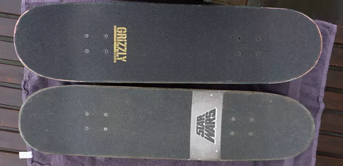 A side-by-side comparison of two cleaned longboards, highlighting the variance in cleaning results