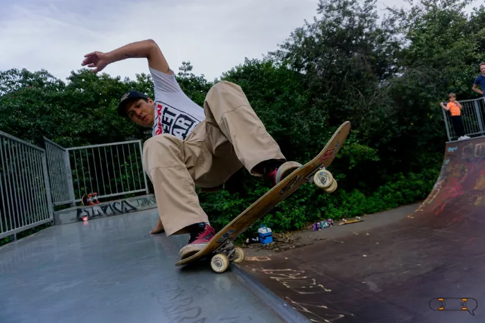 A skateboarder executing an advanced trick, showcasing the technical skills involved in skateboarding.