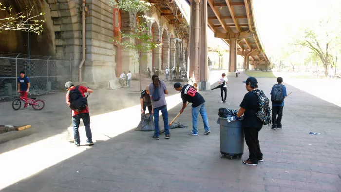 A skateboarder performing a trick at Brooklyn Banks