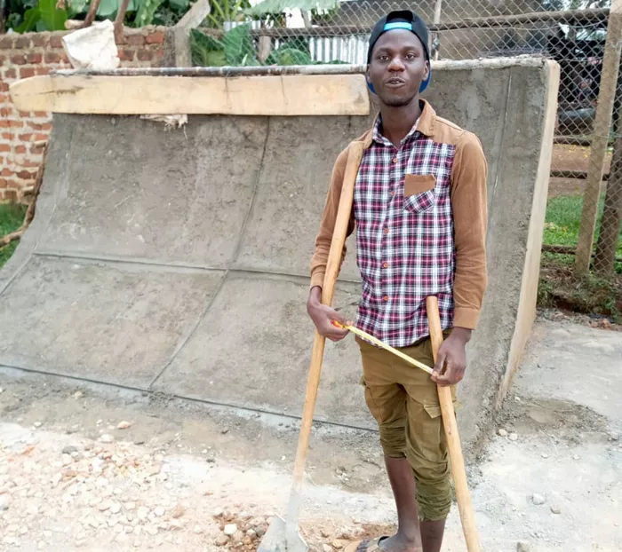 A skateboarder performs a trick at the Uganda Skatepark