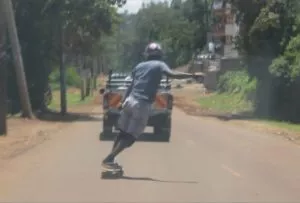 A skater carving down a hill