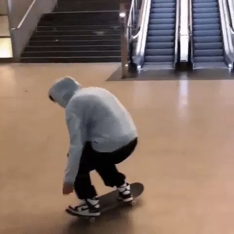 A skater performing a late backside flip