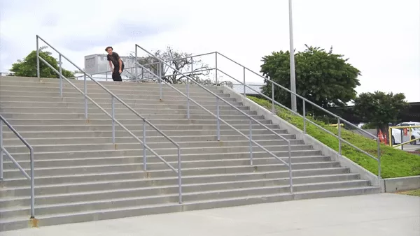 A skater snaps his board on a rail