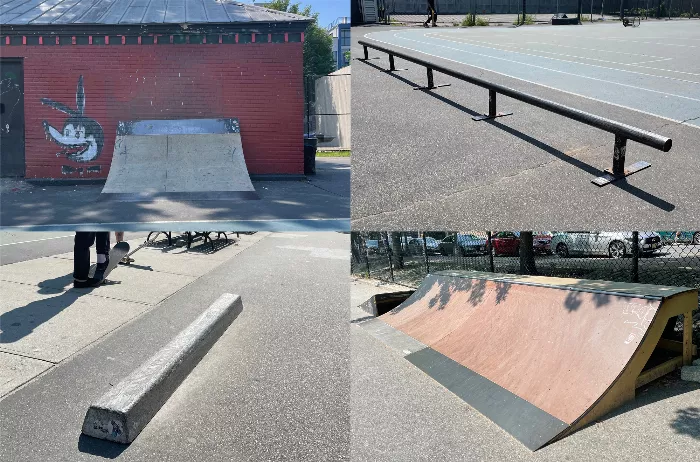 A variety of DIY skate obstacles scattered on the blue concrete surface of Blue Park.