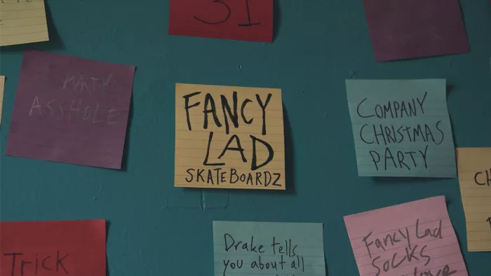 A view of the kitchen with skateboards, strange objects, and a general sense of organized chaos, showing the unique creative space of the Fancy Lad HQ