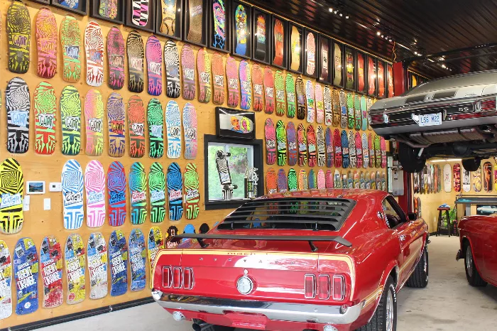 A wall filled with vintage skateboard decks