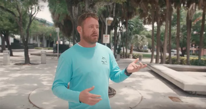 A wide shot of the MLK Ledges skate spot in Miami, Florida, showcasing the various ledges and the surrounding urban environment.