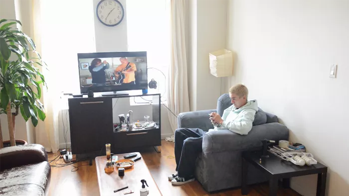 Aaron Herrington making breakfast in his Bed Stuy apartment