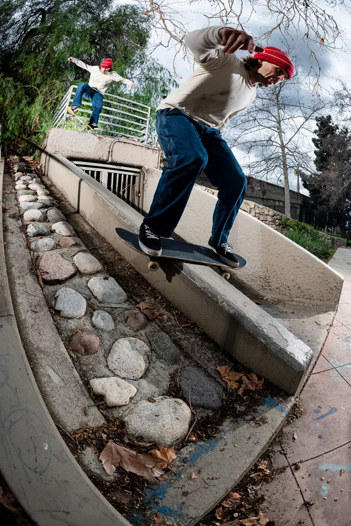 Aidan Campbell performing a 50-50 boardslide trick