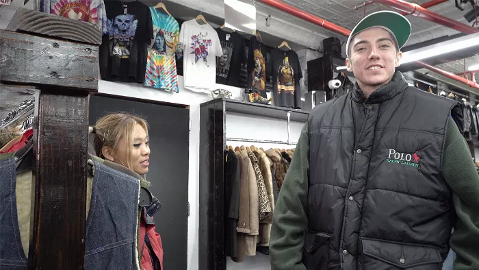 Aleka Lang and Jess Wong browsing through clothes at a Brooklyn thrift store.