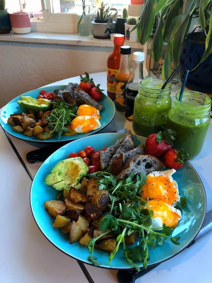 Aleka Lang and Jess Wong preparing food together in their kitchen