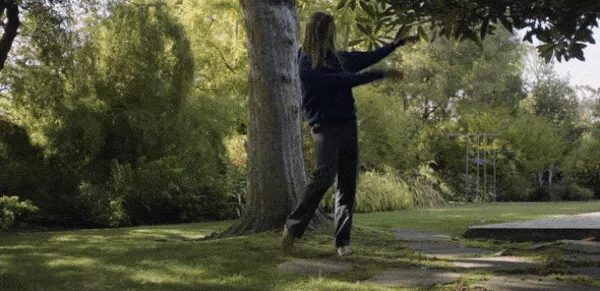 Alex Olson demonstrating a Qigong movement