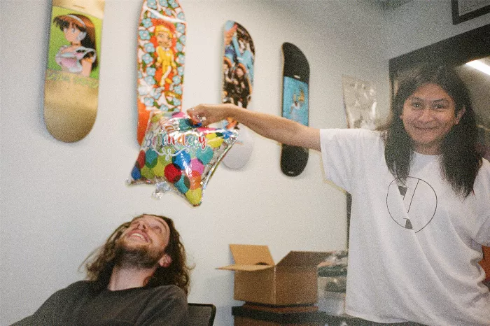 Alexis and Larry with a birthday cake