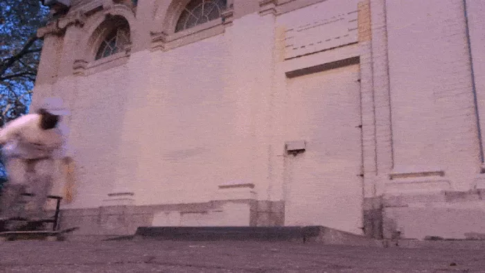 Another animated GIF showing a different angle of the skater attempting the trick