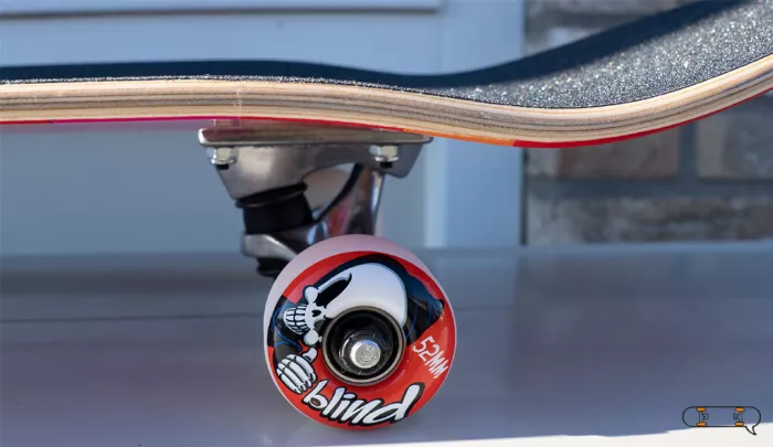 blind skateboard wheels and deck close up