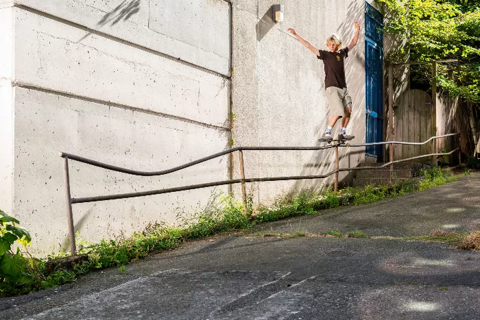 Caden Smith performing a frontside 5050 in Vancouver