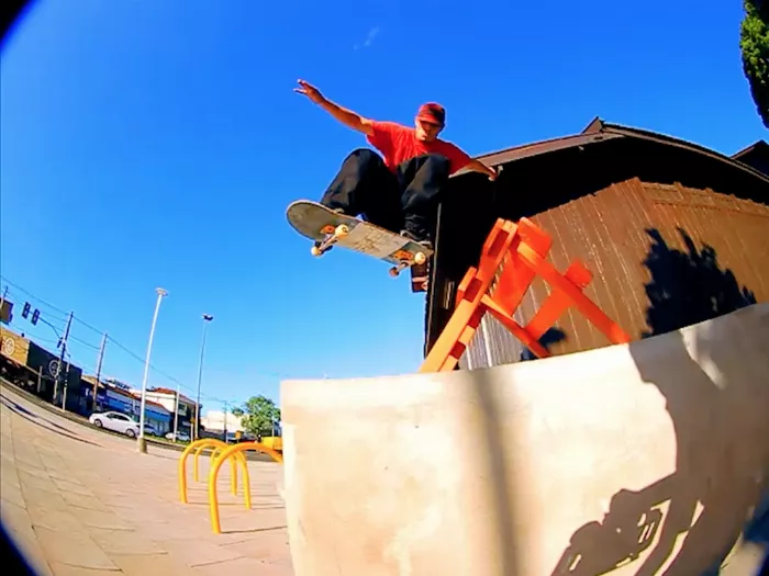 Carlos Bueno executing a trick in the Street Survivors Vol. 3 skateboarding video.