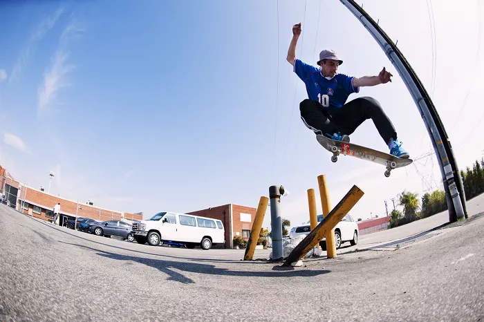 Chewy Cannon doing a nosegrind polejam