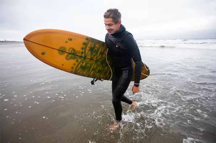 Chico Brenes, Rob Welsh, Elissa Steamer, and Max Schaaf, four skaters who also surf, in a collage.