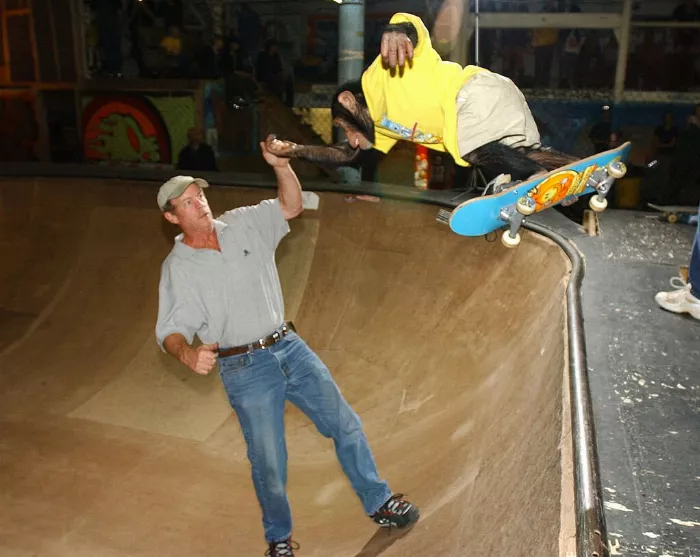 Chimp skateboarding in a bowl