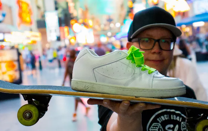 Close-up of Black Ninja's white skate shoe.