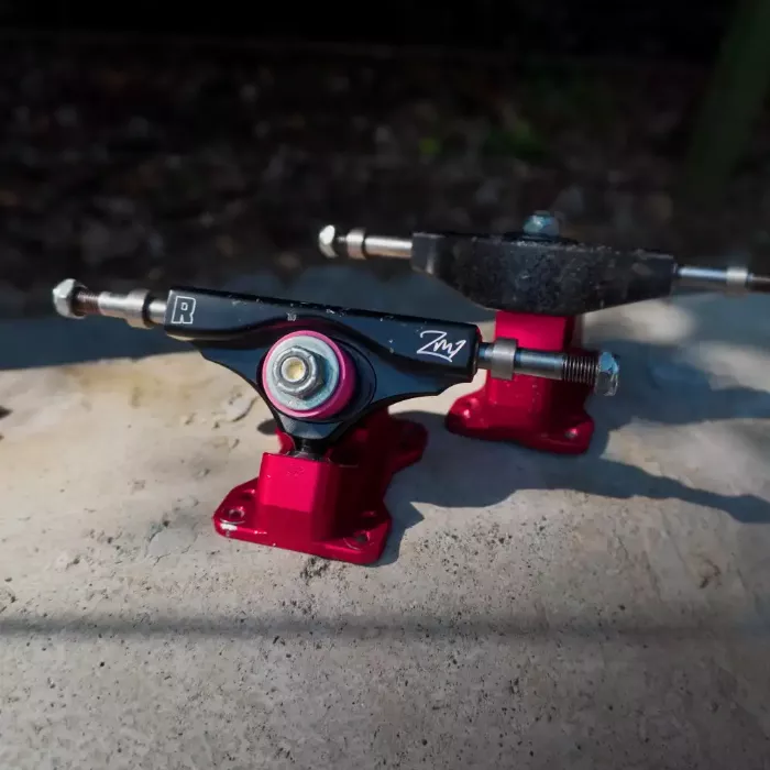 Close-up of Rogue ZM1 trucks on a skateboard