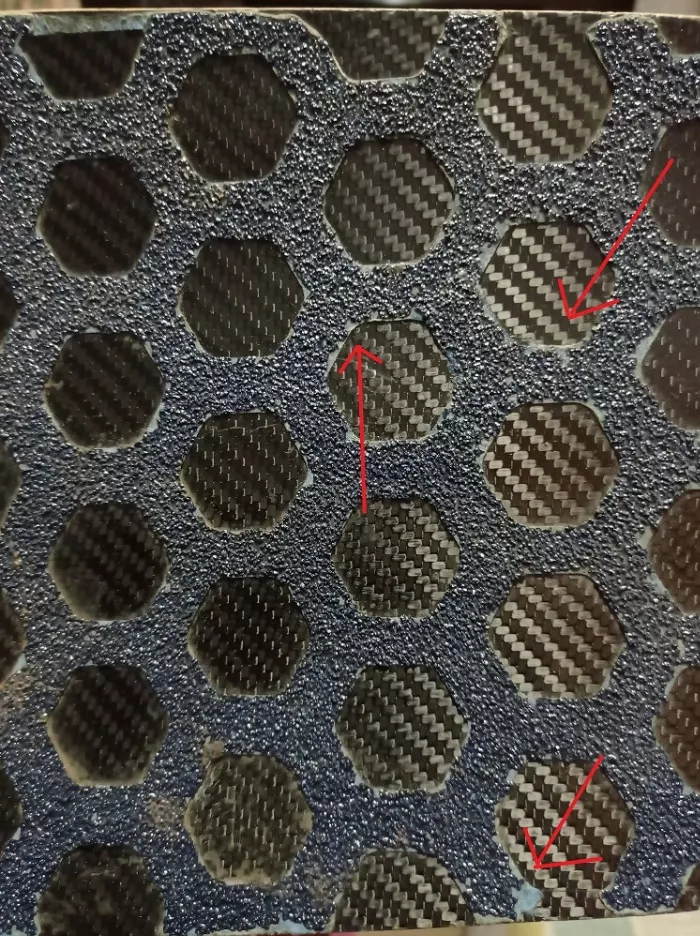 Close-up of Seismic Lokton griptape showing some minor flaking on cutouts