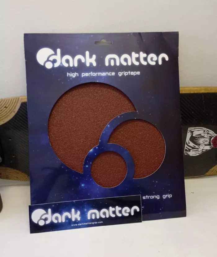 Dark Matter grip tape packaging with logo sheet and stickers